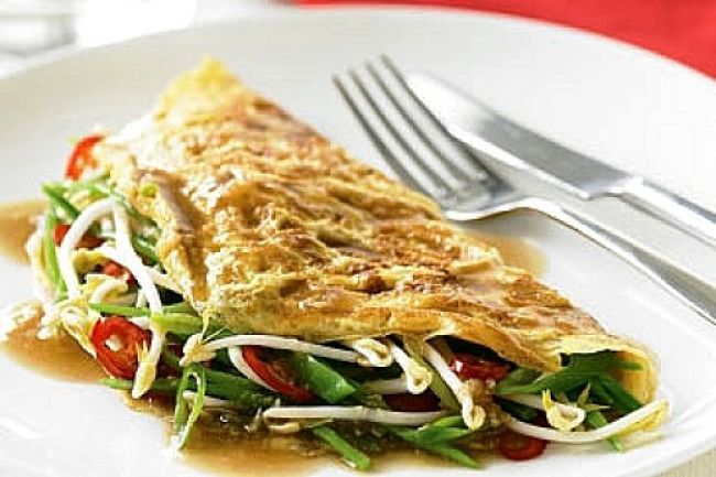 Omelettes with fresh vegetables and sprouts