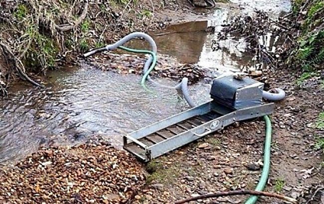 Various machines increase the rate at which the pay-dirt can be processed, but they are heavy and cumbersome to move and locate