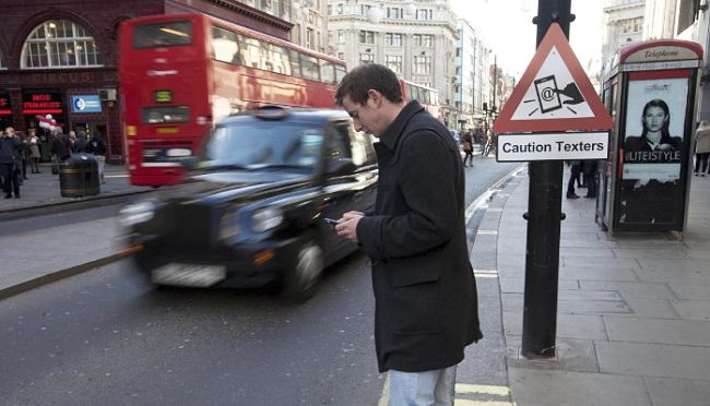 Texting while walking can be very dangerous despite all the warnings