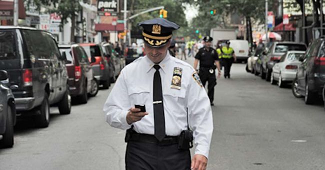 Even police are guilty of texting while walking